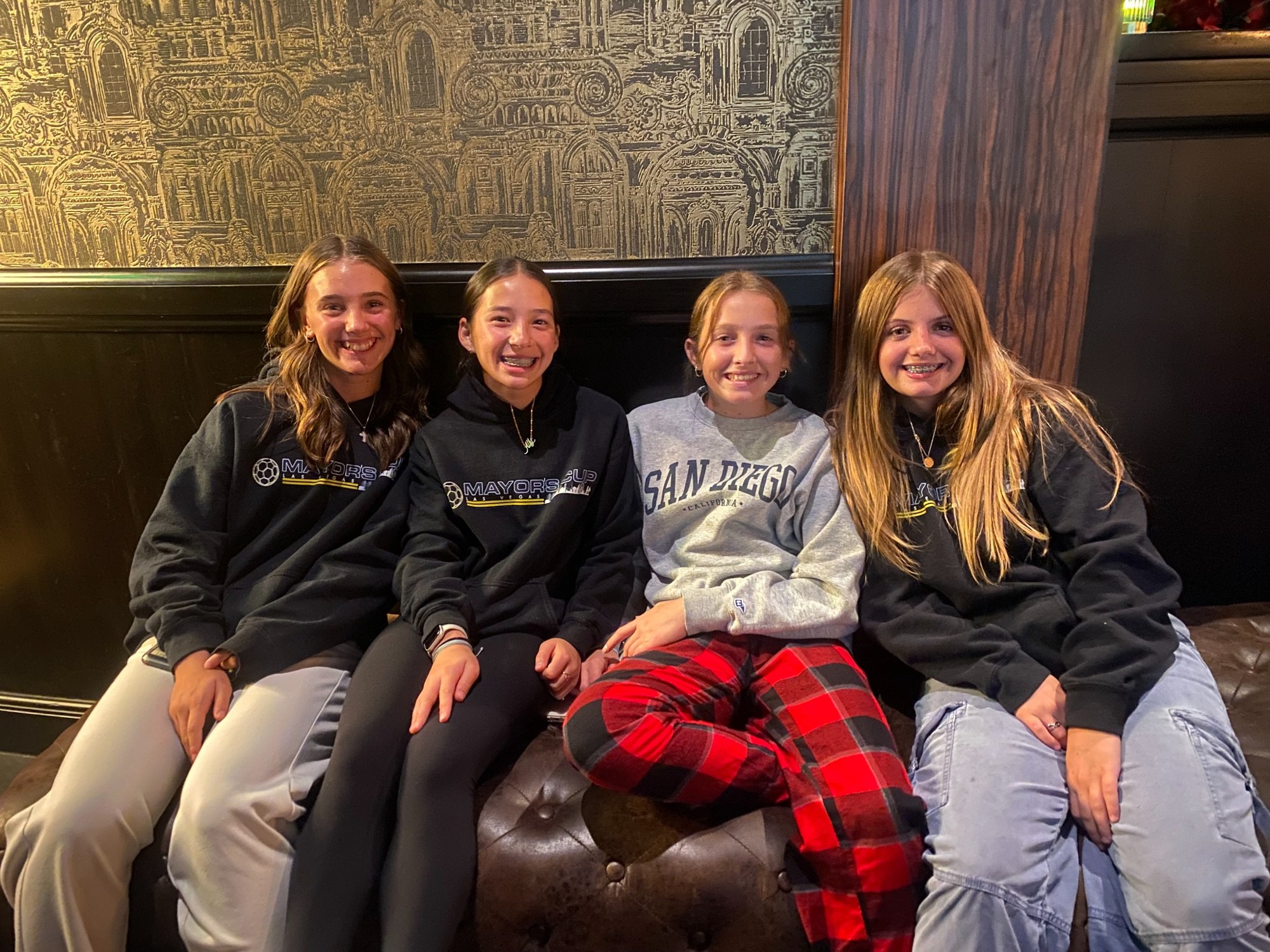 Four teammates relaxing together