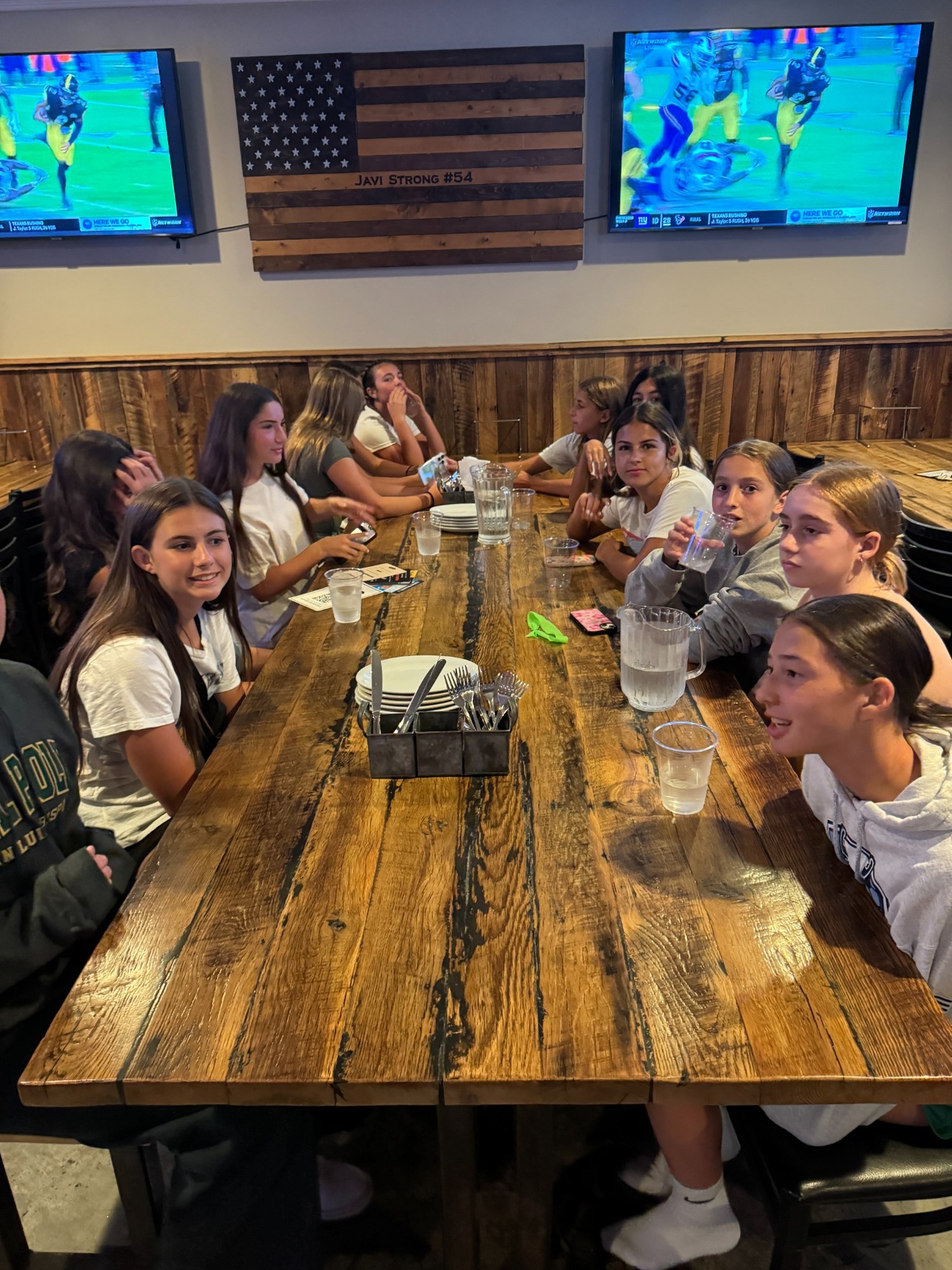 Players gathered around the table for a team meal